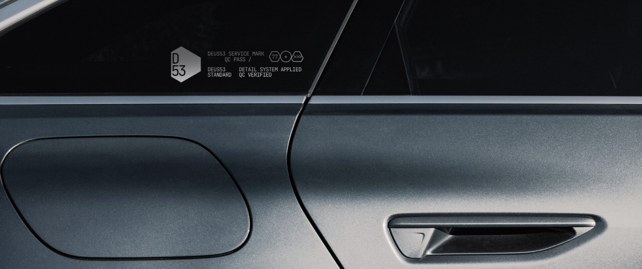 Deus 53 detailing studio brand identity — entrance door branding
